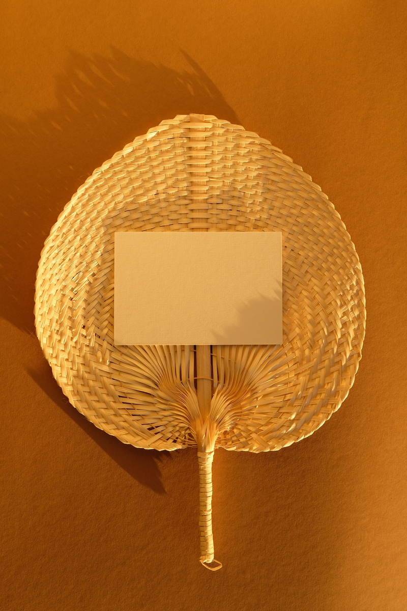 Paper Card Mockup in Rattan Plate in Sunlight of Sunset.